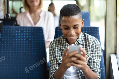 Preview: Happy black guy using cell phone in bus