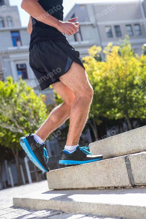 Preview: Athlete jogging up the stairs in the city