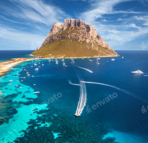 Preview: Aerial view of luxury yachts and boats on blue sea, mountain