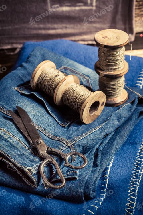 Preview: Closeup of cloth and needle in a tailor workshop