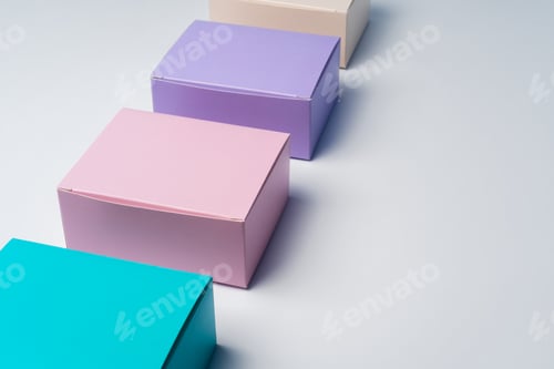 Preview: Pile of colorful cardboard boxes on white background