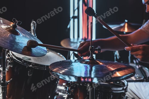 Preview: A male drummer plays drums with special drum sticks.