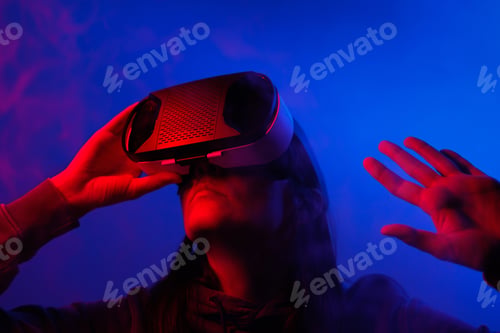 Preview: games and watching movies. a woman touches her glasses with her hands, puts