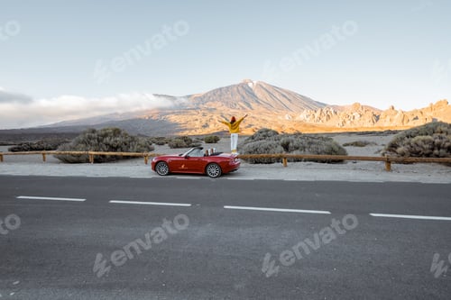 Preview: Woman traveling by car on the volcanic valley