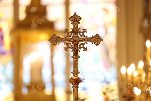 Preview: The cross standing on christian church and flare background.