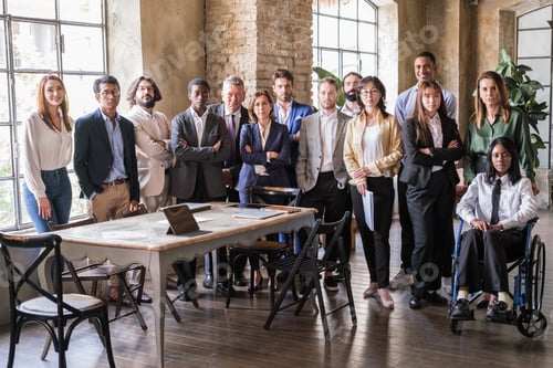 Preview: Group of multicultural businesspeople standing at team meeting