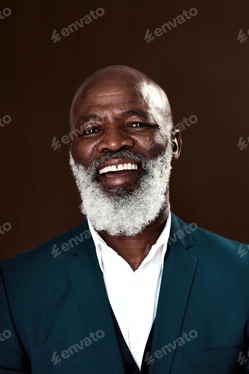 Preview: Studio shot of a mature businessman posing against a brown background