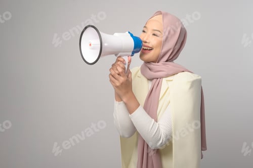 Preview: Woman holding megaphone over white background