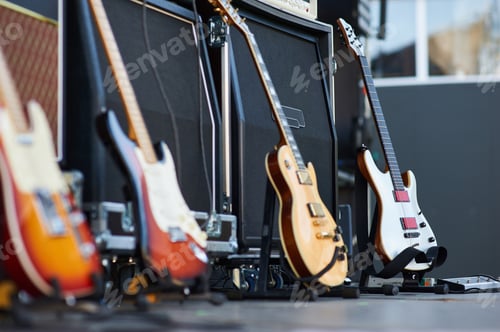 Preview: amplifier with electric guitar on the stage. music instrument set for guitarist. no people
