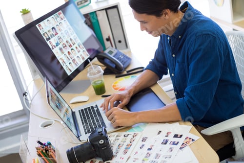 Preview: Male executive working over laptop at his desk