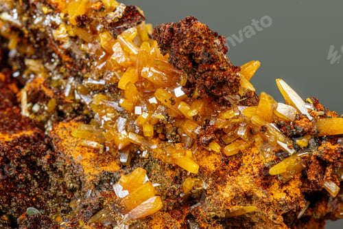 Preview: macro mineral Wulfenite stone on a black background