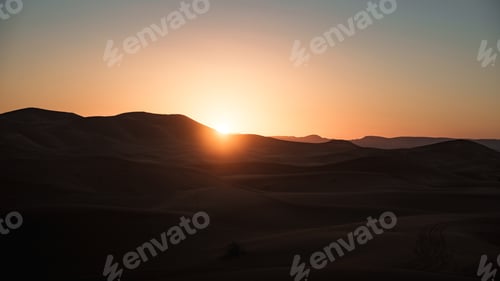 Preview: Sun rising over erg chebbi dunes in merzouga desert, morocco
