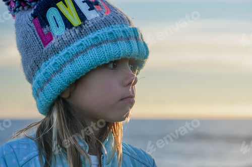 Preview: Child Wearing Hat Looking at Beach and Horizon