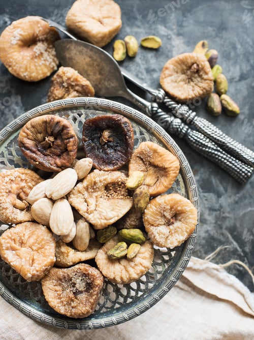 Preview: Dried figs and nuts served on antique plate, close-up
