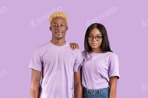 Preview: Portrait of handsome black man and his girlfriend in glasses posing and looking at camera over