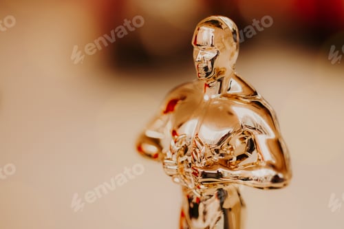 Preview: Nomination and Oscar reward concept. Golden statue for victory and success
