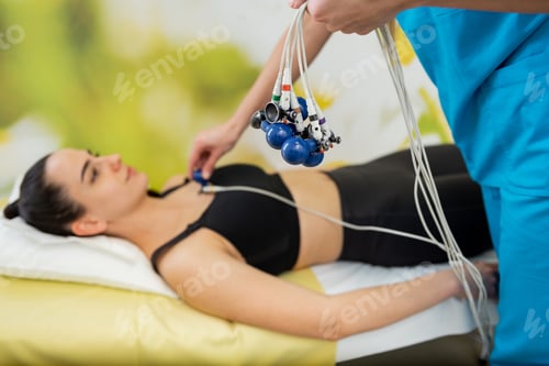 Preview: Serene moment during a comprehensive electrocardiogram test in a bright medical facility