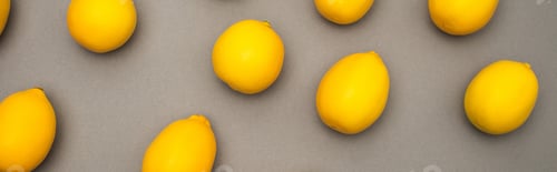 Preview: high angle view of fresh and yellow lemons on grey background, banner