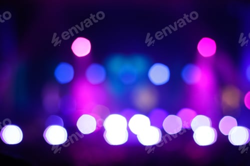 Preview: blurred abstract purple bokeh background. Rock concert performing on stage with musician with purple