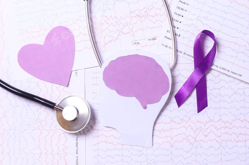 Preview: Purple ribbon, stethoscope and purple heart shape on encephalogram paper
