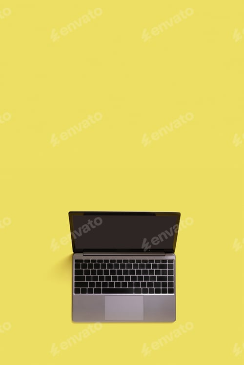 Preview: Top view of modern laptop isolated on yellow background. Copy space