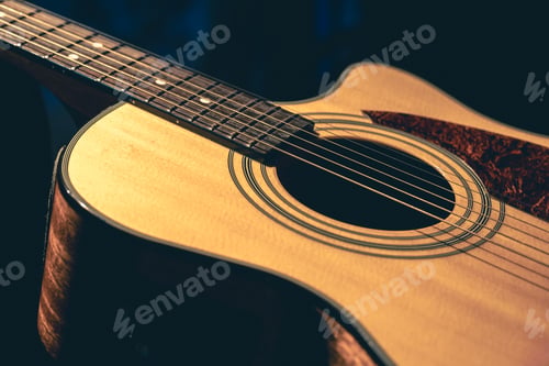 Preview: Musical background with acoustic guitar close up.