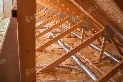 Preview: Wooden Rafters and Insulation in a Residential Attic Under Construction