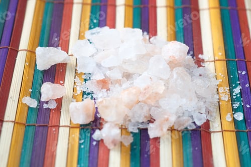 Preview: close up of pink rock salt in a bowl on table