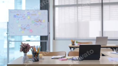 Preview: Startup business office interior with tables, laptop computers, chairs and whiteboard.
