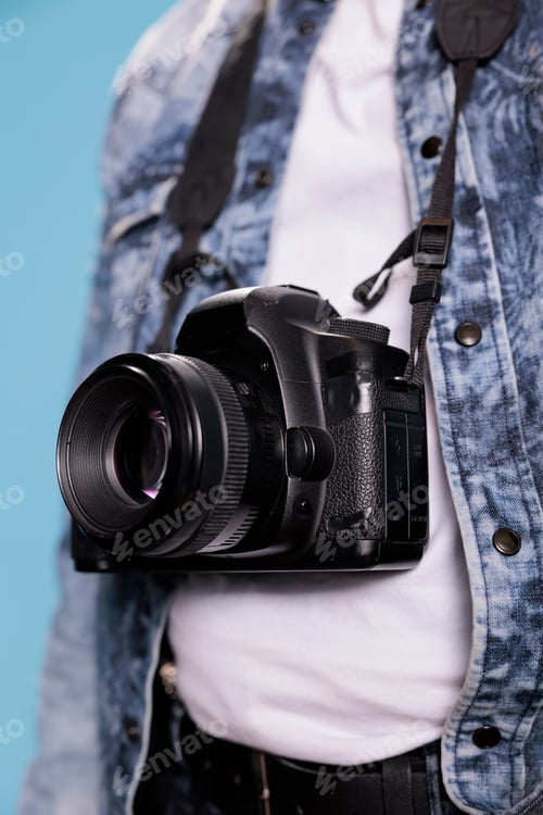 Preview: Close up shot of professional photographer having photo device