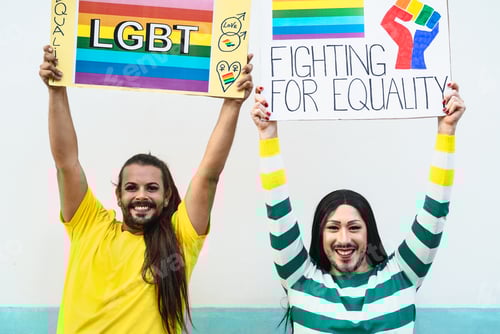 Preview: Happy drag queen activists protesting during gay pride parade - LGBT social movement concept