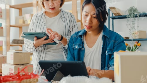 Preview: businesswomen meeting check product purchase order on stock and save to tablet computer.
