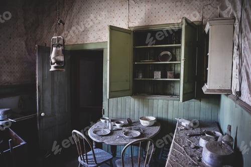 Preview: Dusty Abandoned Kitchen with Table and Chairs