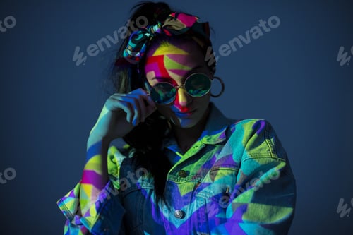 Preview: Woman with face colored with light