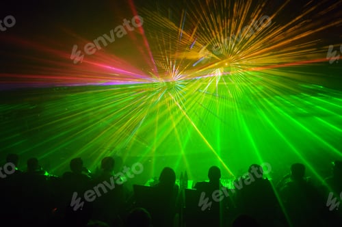 Preview: Row of people facing a laser light show