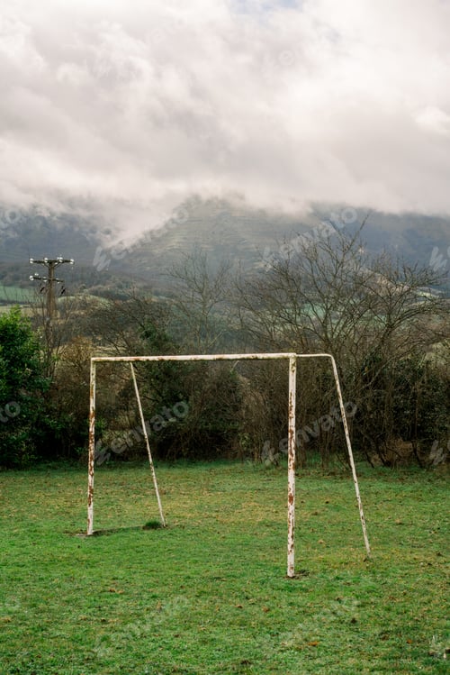 Preview: Old soccer post on meadow