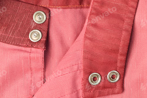 Preview: Close up view of silver buttons on cloth