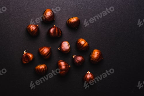 Preview: Ripe chestnuts close up. Raw Chestnuts for Christmas. Fresh sweet chestnut. Food background