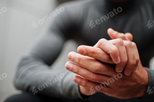 Preview: Close up hands of stylish man wear grey turtleneck.