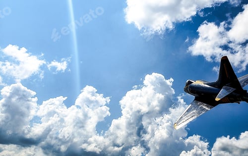 Preview: Close up airplane in a beautiful blue sky with puffy cloudscape in minimalism.