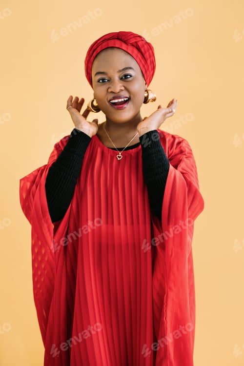 Preview: Beautiful emotional smiling woman with bright makeup against yellow background. Studio shot of