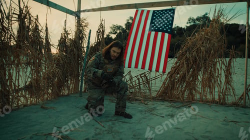 Preview: Radio call for help from an American soldier in a desert hut new the flag