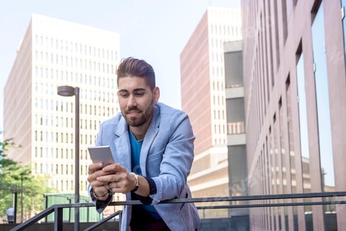 Preview: Man Using Phone in Urban Business Environment