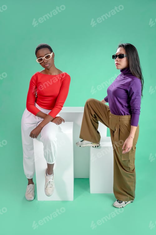 Preview: Two women pose on a color background