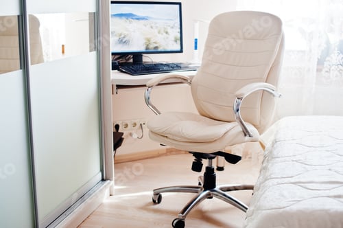 Preview: White leather luxury office chair background monitor of computer at light room.