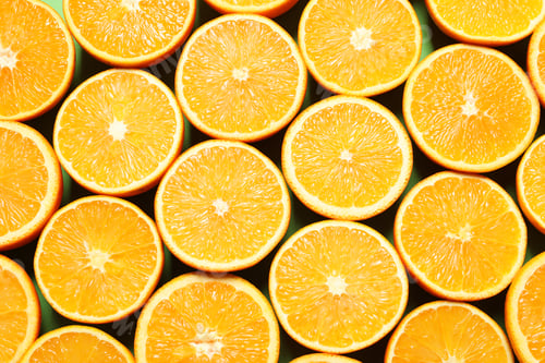 Preview: Halves of ripe oranges as background, top view