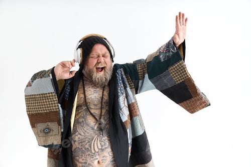 Preview: Fat stylish bearded tattoed caucasian man with big belly is posing and dancing wearing ethnic kimono