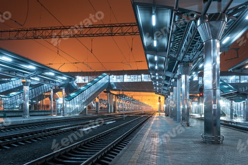 Preview: Railway station at night. Train platform in fog. Railroad