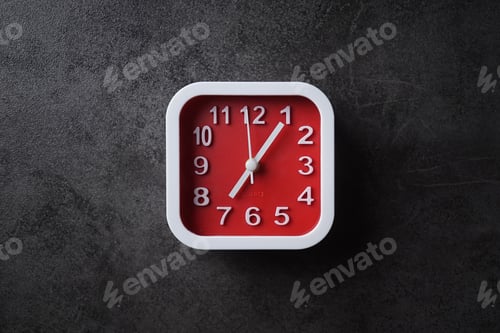 Preview: Day Time Alarm Clock On Dark Table Background For Time Concept