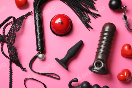 Preview: Set of different sex toys on pink background, flat lay